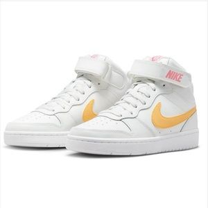pink and yellow high top nike shoes
